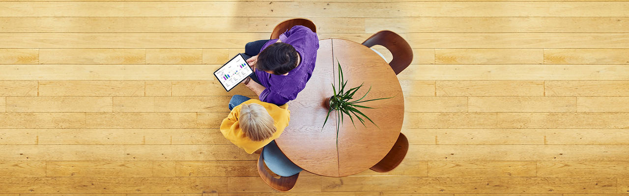 Couple of people looking at an ipad