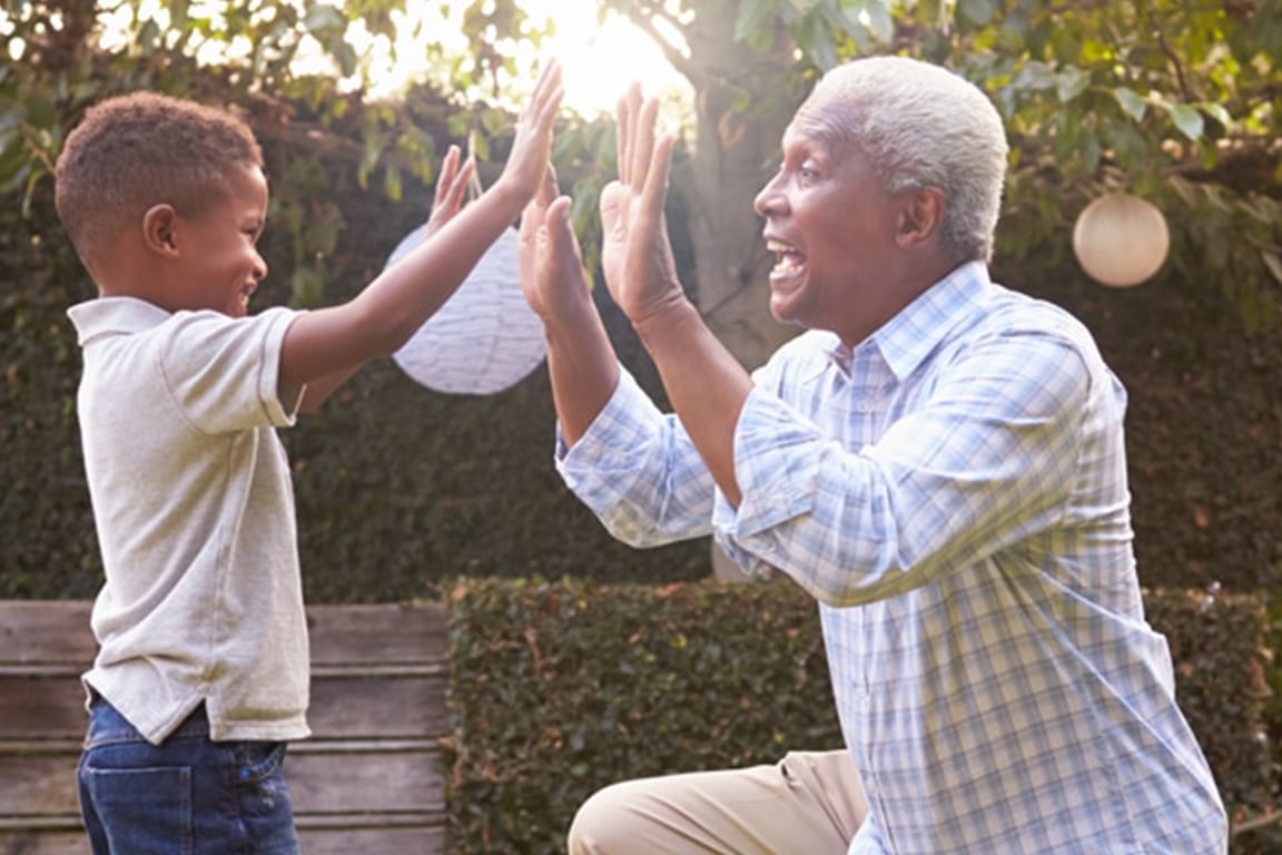 grandfather playing with grandson