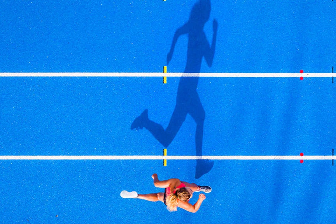 woman running on track